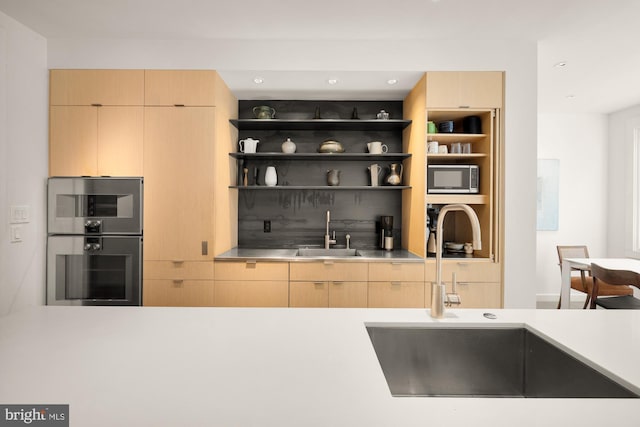 1800 Lamont St NW, Washington, DC 20010 - kitchen with a sink, appliances with stainless steel finishes, light brown cabinetry, modern cabinets, and recessed lighting