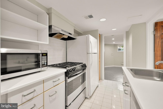 1800 Lamont St NW, Washington, DC 20010 - kitchen featuring appliances with stainless steel finishes, a sink, extractor fan, recessed lighting, and backsplash