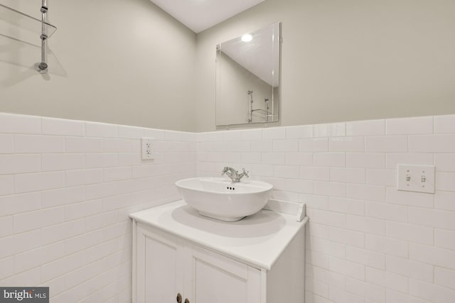 1800 Lamont St NW, Washington, DC 20010 - bathroom with tile walls, vanity, and wainscoting