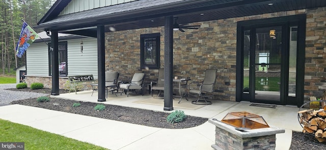 2204 Baker Mountain Dr, Yellow Spring, WV 26865 - view of exterior entry featuring stone siding, a porch, and board and batten siding