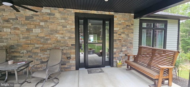 2204 Baker Mountain Dr, Yellow Spring, WV 26865 - entrance to property featuring stone siding, a porch, and ceiling fan