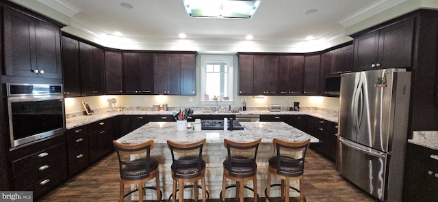2204 Baker Mountain Dr, Yellow Spring, WV 26865 - kitchen featuring stainless steel appliances, crown molding, dark wood-type flooring, a breakfast bar area, and light stone countertops