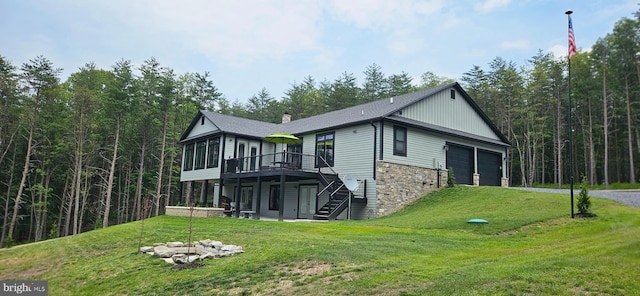2204 Baker Mountain Dr, Yellow Spring, WV 26865 - back of property featuring a deck, a lawn, stone siding, asphalt driveway, and stairway