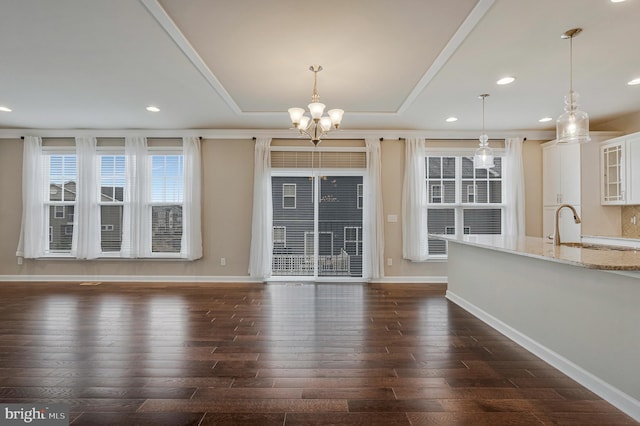 22277 Foggy Ridge Ter, Ashburn, VA 20148 - unfurnished dining area featuring dark wood finished floors, a chandelier, baseboards, a sink, and recessed lighting