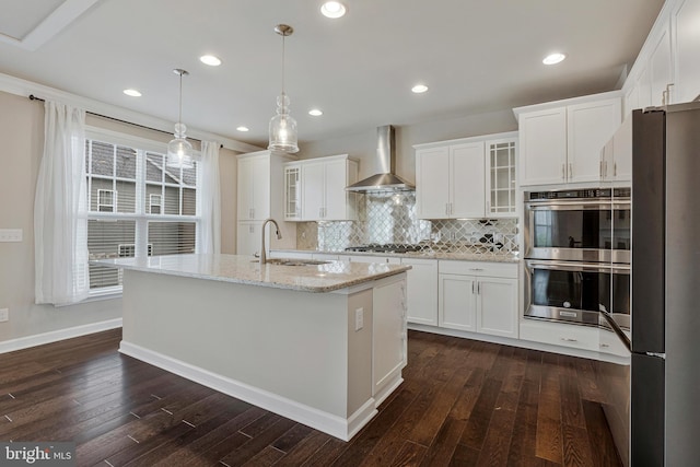 22277 Foggy Ridge Ter, Ashburn, VA 20148 - kitchen with wall chimney range hood, stainless steel double oven, freestanding refrigerator, a sink, and dark wood-type flooring
