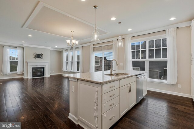 22277 Foggy Ridge Ter, Ashburn, VA 20148 - kitchen featuring a sink, stainless steel dishwasher, baseboards, dark wood-style floors, and pendant lighting