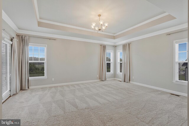 22277 Foggy Ridge Ter, Ashburn, VA 20148 - empty room with a tray ceiling, a chandelier, crown molding, baseboards, and carpet floors