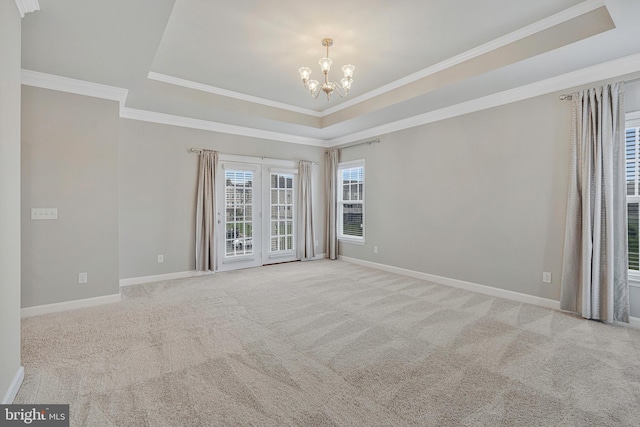 22277 Foggy Ridge Ter, Ashburn, VA 20148 - carpeted spare room with a tray ceiling, a chandelier, ornamental molding, and baseboards