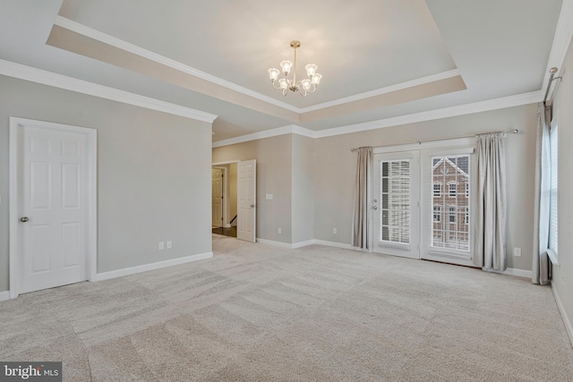 22277 Foggy Ridge Ter, Ashburn, VA 20148 - empty room featuring a raised ceiling, a chandelier, baseboards, ornamental molding, and carpet floors