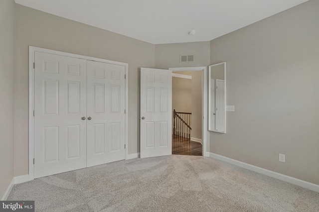 22277 Foggy Ridge Ter, Ashburn, VA 20148 - unfurnished bedroom with carpet flooring, baseboards, and a closet