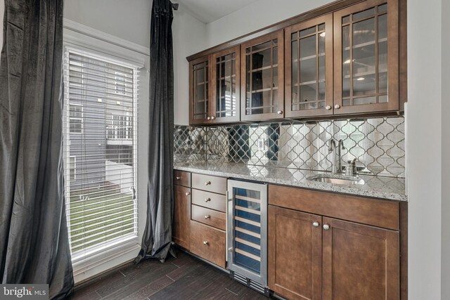 22277 Foggy Ridge Ter, Ashburn, VA 20148 - indoor wet bar featuring wine cooler, dark wood-style floors, backsplash, and healthy amount of natural light