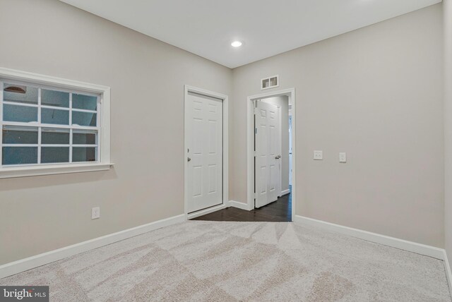 22277 Foggy Ridge Ter, Ashburn, VA 20148 - empty room featuring dark colored carpet, baseboards, and recessed lighting