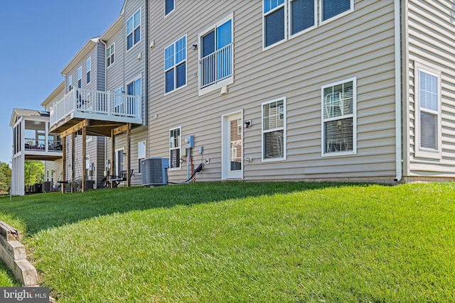 22277 Foggy Ridge Ter, Ashburn, VA 20148 - rear view of property featuring central AC unit and a lawn