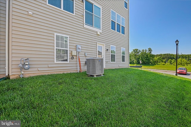 22277 Foggy Ridge Ter, Ashburn, VA 20148 - rear view of house featuring central AC and a yard