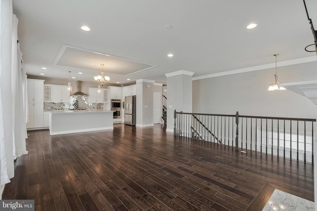 22277 Foggy Ridge Ter, Ashburn, VA 20148 - unfurnished living room with crown molding, dark wood finished floors, a chandelier, recessed lighting, and baseboards