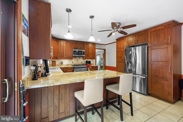 1541 Clayton Delaney Rd, Clayton, DE 19938 - kitchen featuring appliances with stainless steel finishes, a ceiling fan, a peninsula, a sink, and backsplash