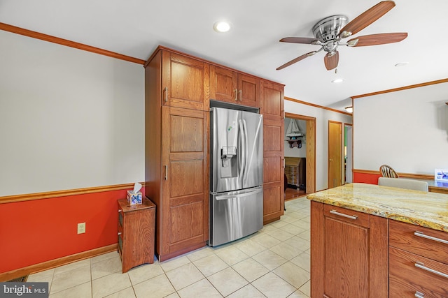 1541 Clayton Delaney Rd, Clayton, DE 19938 - kitchen featuring stainless steel fridge with ice dispenser, ornamental molding, ceiling fan, light tile patterned floors, and light stone counters
