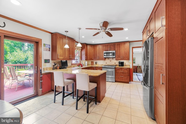 1541 Clayton Delaney Rd, Clayton, DE 19938 - kitchen featuring stainless steel appliances, a peninsula, crown molding, ceiling fan, and recessed lighting