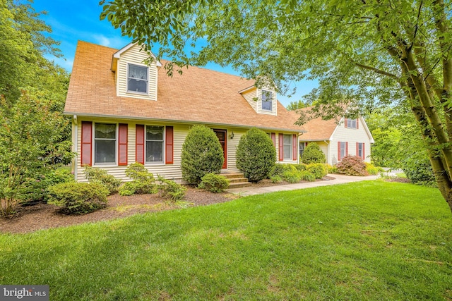 1541 Clayton Delaney Rd, Clayton, DE 19938 - cape cod-style house featuring a front yard and roof with shingles