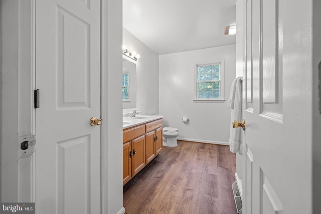 1541 Clayton Delaney Rd, Clayton, DE 19938 - bathroom with vanity, wood finished floors, baseboards, and toilet