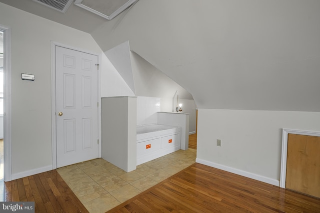 1541 Clayton Delaney Rd, Clayton, DE 19938 - bonus room featuring light wood-type flooring, vaulted ceiling, attic access, and baseboards