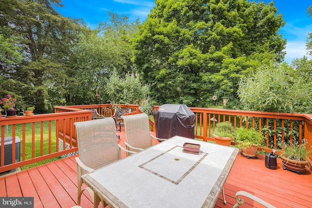 1541 Clayton Delaney Rd, Clayton, DE 19938 - wooden deck featuring outdoor dining area, area for grilling, and central AC unit