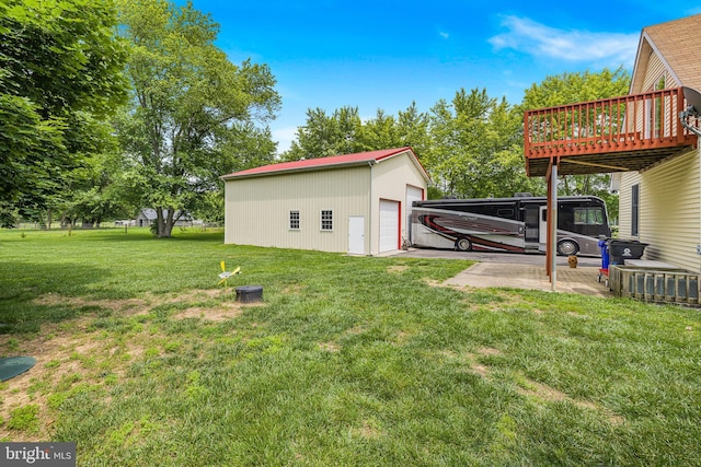 1541 Clayton Delaney Rd, Clayton, DE 19938 - view of green lawn with a detached garage, an outdoor structure, and a deck