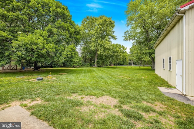 1541 Clayton Delaney Rd, Clayton, DE 19938 - view of green lawn with view of wooded area