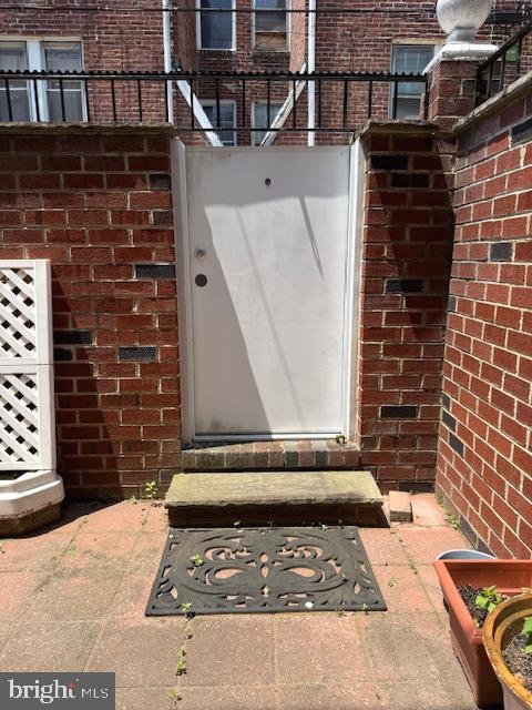 7316 Pittville Ave, Philadelphia, PA 19126 - entrance to property with brick siding