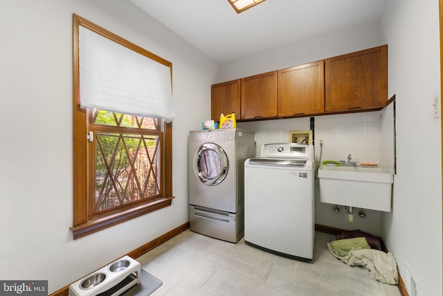 15713 Holly Grove Rd, Silver Spring, MD 20905 - laundry room featuring washing machine and dryer, cabinet space, and baseboards