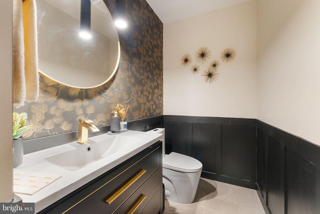 15713 Holly Grove Rd, Silver Spring, MD 20905 - bathroom with a wainscoted wall, toilet, wallpapered walls, and vanity