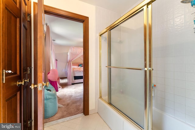 15713 Holly Grove Rd, Silver Spring, MD 20905 - ensuite bathroom featuring bath / shower combo with glass door and tile patterned floors