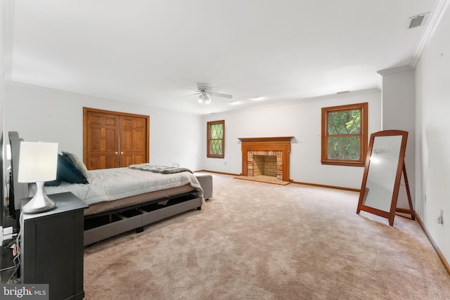 15713 Holly Grove Rd, Silver Spring, MD 20905 - carpeted bedroom featuring crown molding, baseboards, a closet, a brick fireplace, and ceiling fan