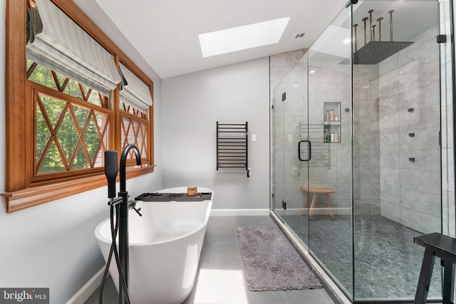 15713 Holly Grove Rd, Silver Spring, MD 20905 - full bath with baseboards, a skylight, a shower stall, and a freestanding bath