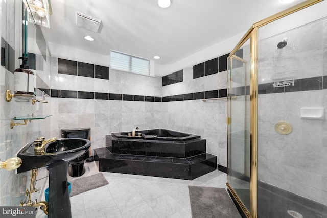 15713 Holly Grove Rd, Silver Spring, MD 20905 - full bath featuring tile walls, a bath, a shower stall, and recessed lighting