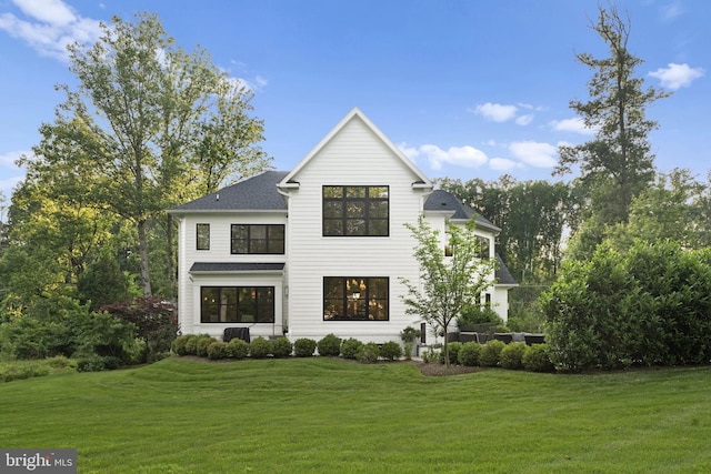 717 Miller Ave, Great Falls, VA 22066 - view of front of home with a front lawn and roof with shingles