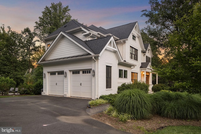 717 Miller Ave, Great Falls, VA 22066 - view of front of home featuring asphalt driveway, brick siding, roof with shingles, and a garage