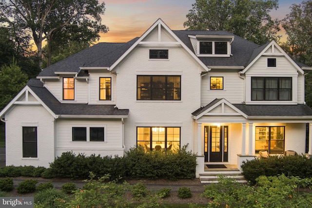 717 Miller Ave, Great Falls, VA 22066 - modern farmhouse style home featuring brick siding and a shingled roof