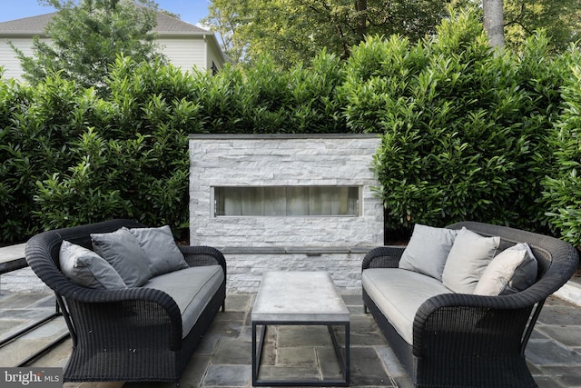 717 Miller Ave, Great Falls, VA 22066 - view of patio with an outdoor living space with a fireplace