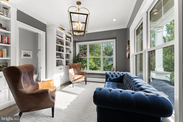 717 Miller Ave, Great Falls, VA 22066 - sitting room with a chandelier, built in shelves, ornamental molding, light wood-style flooring, and recessed lighting