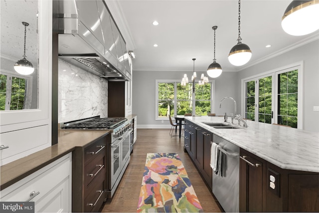 717 Miller Ave, Great Falls, VA 22066 - kitchen with appliances with stainless steel finishes, wall chimney exhaust hood, dark wood finished floors, decorative backsplash, and dark brown cabinetry