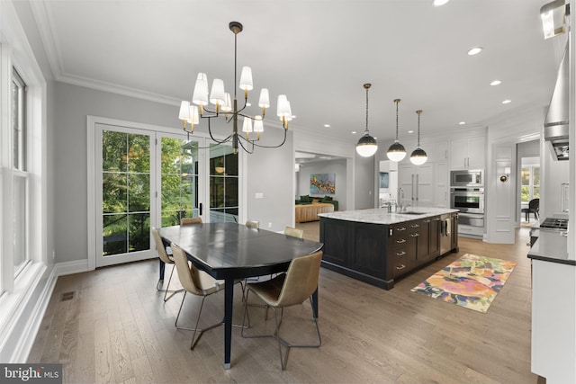 717 Miller Ave, Great Falls, VA 22066 - dining space featuring light wood finished floors, a chandelier, recessed lighting, and crown molding