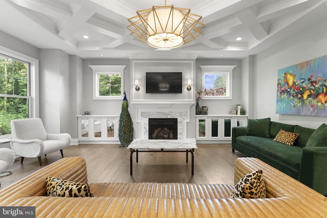 717 Miller Ave, Great Falls, VA 22066 - living room featuring coffered ceiling, hardwood / wood-style floors, plenty of natural light, a high end fireplace, and beamed ceiling