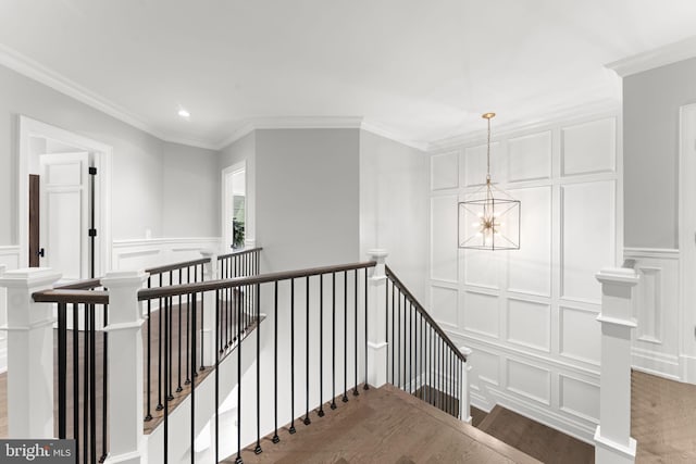 717 Miller Ave, Great Falls, VA 22066 - staircase with a decorative wall, a chandelier, ornamental molding, wood finished floors, and recessed lighting