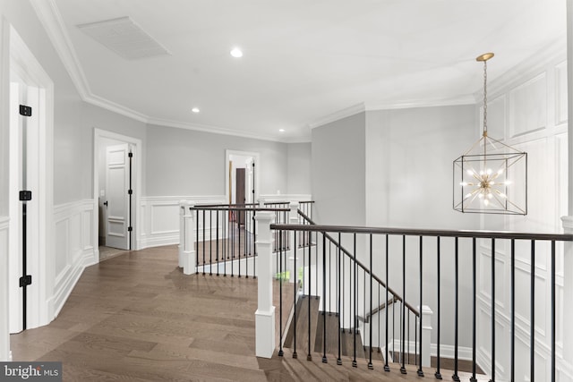 717 Miller Ave, Great Falls, VA 22066 - hallway with an upstairs landing, a chandelier, recessed lighting, crown molding, and a decorative wall