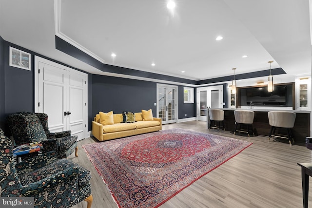 717 Miller Ave, Great Falls, VA 22066 - living room with ornamental molding, light wood-type flooring, recessed lighting, and french doors