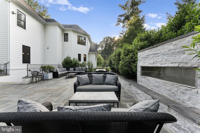 717 Miller Ave, Great Falls, VA 22066 - view of patio / terrace with an outdoor living space with a fireplace