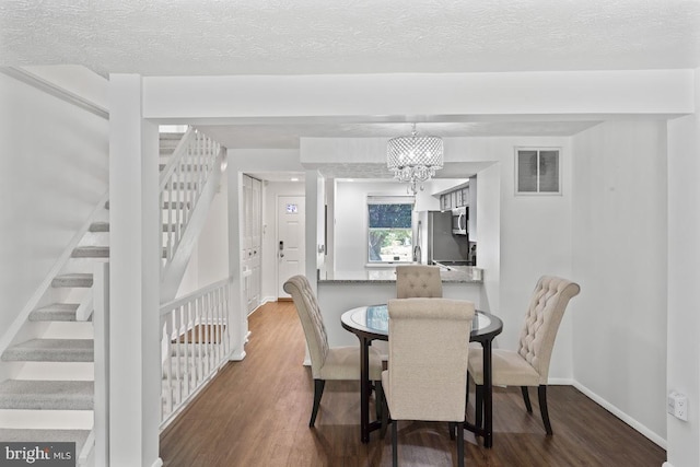 13825 Palmer House Way Unit 32-237, Silver Spring, MD 20904 - dining area with stairway, wood finished floors, a chandelier, and a textured ceiling