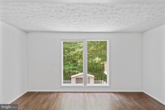 13825 Palmer House Way Unit 32-237, Silver Spring, MD 20904 - unfurnished room with wood finished floors and a textured ceiling