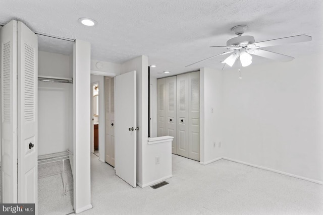 13825 Palmer House Way Unit 32-237, Silver Spring, MD 20904 - unfurnished bedroom featuring multiple closets, carpet, recessed lighting, ceiling fan, and a textured ceiling